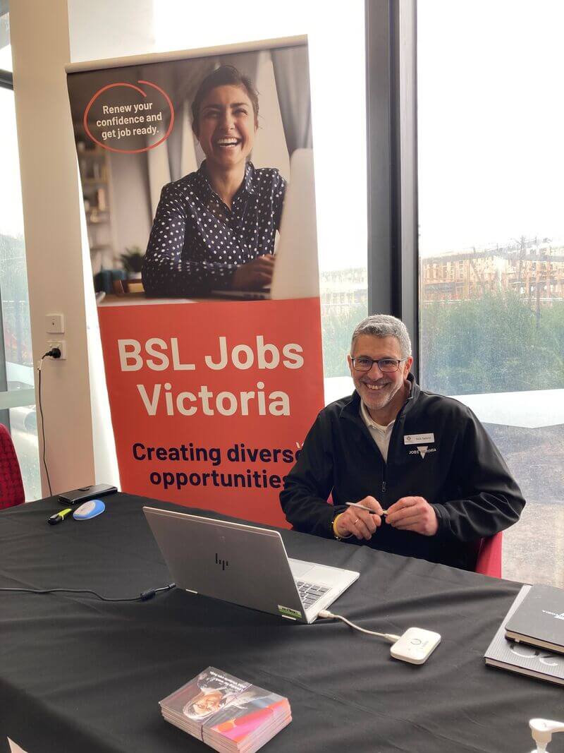 An employee at a pop-up stand for The Brotherhood of St. Laurence’s Jobs Victoria program.
